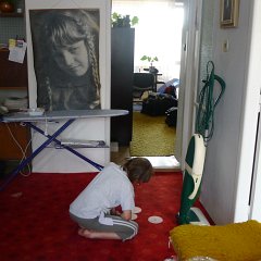 Sammy entertains himself playing with old CDs